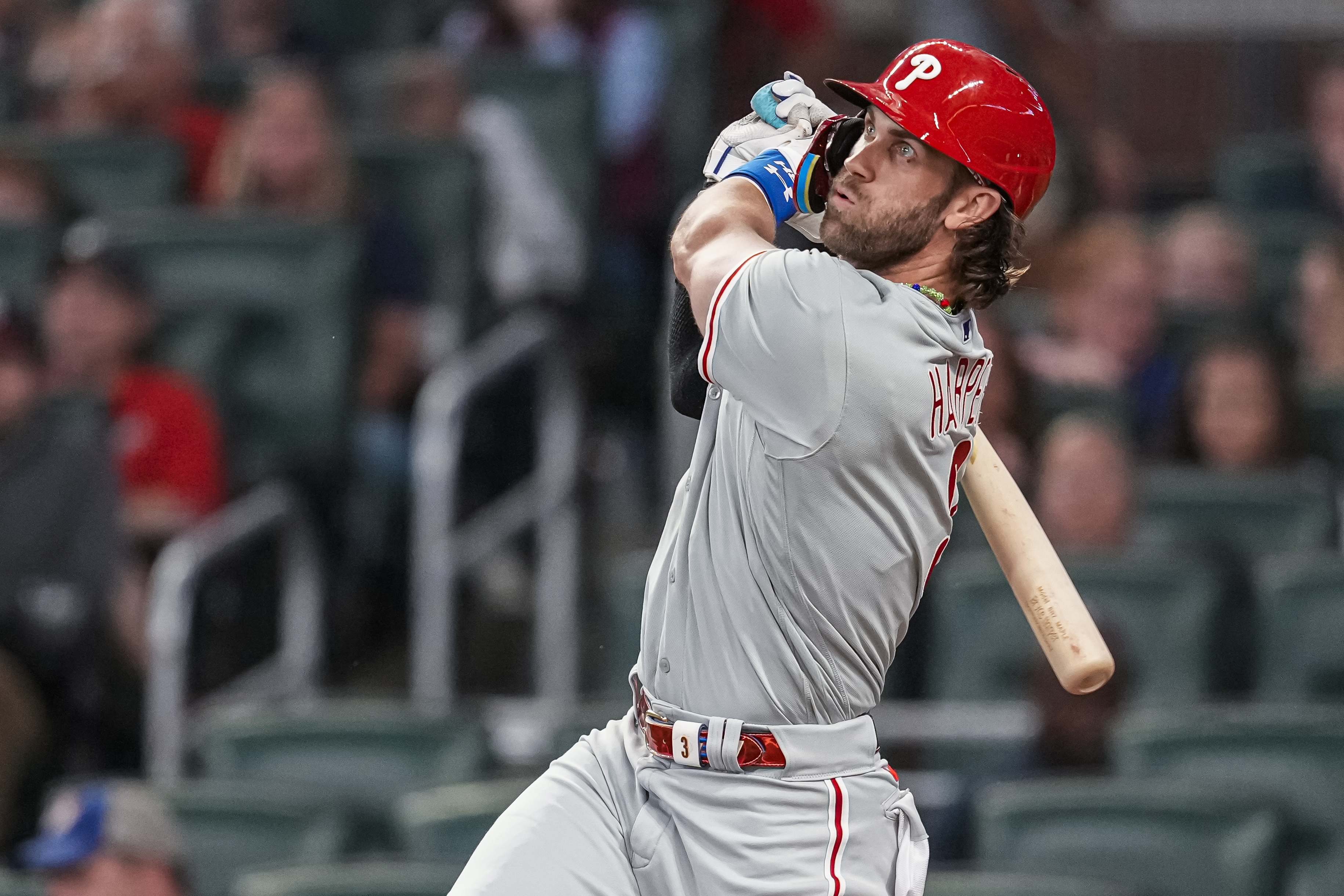 Sep 18, 2023; Cumberland, Georgia, USA; Philadelphia Phillies first baseman Bryce Harper (3) watches the ball after hitting a home run against the Atlanta Braves during the third inning at Truist Park.